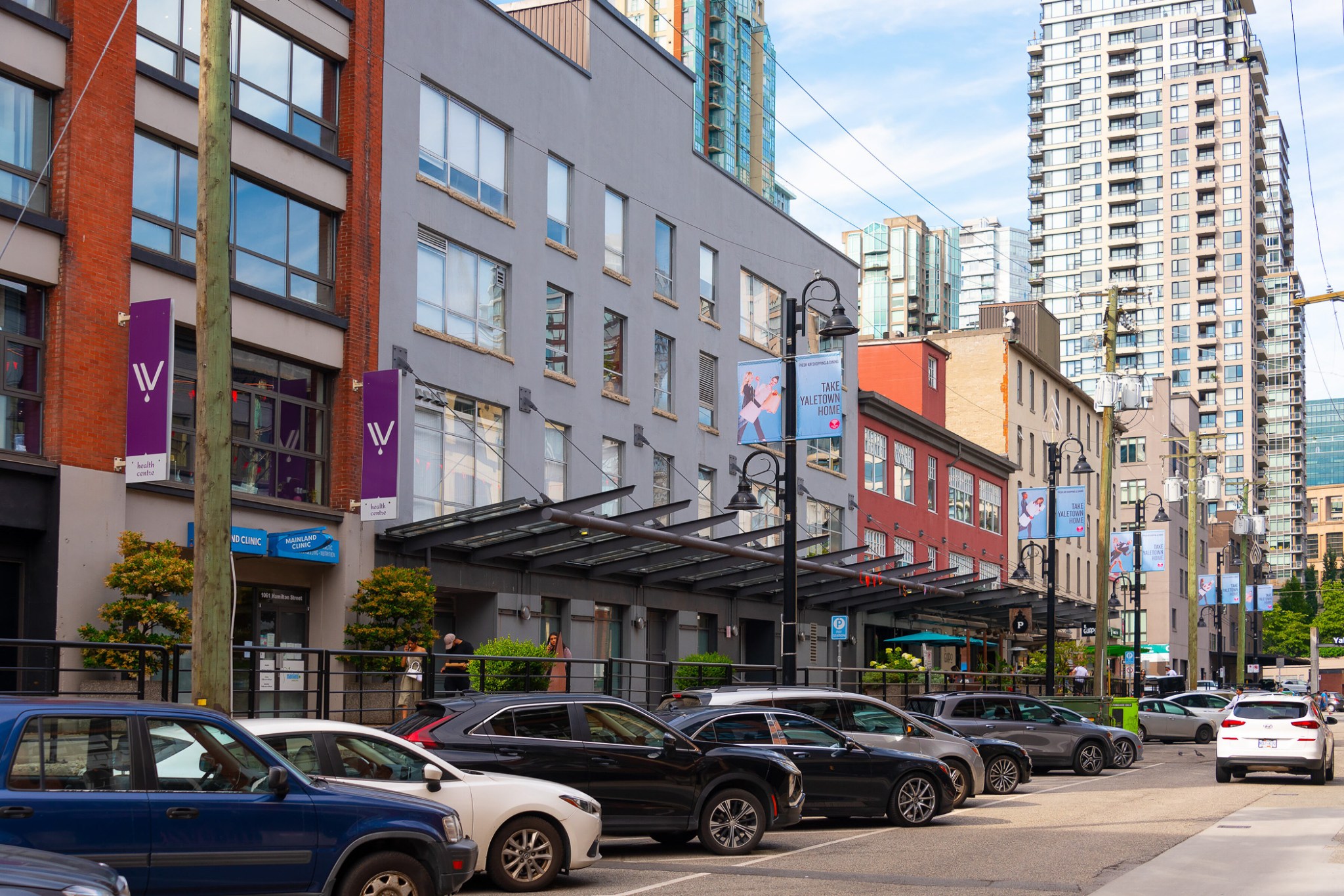 Heritage warehouse buildings and condo towers on Hamilton Street in Yaletown, Vancouver